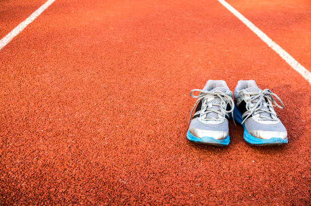 istock Sport shoes on racetrack 1060556214