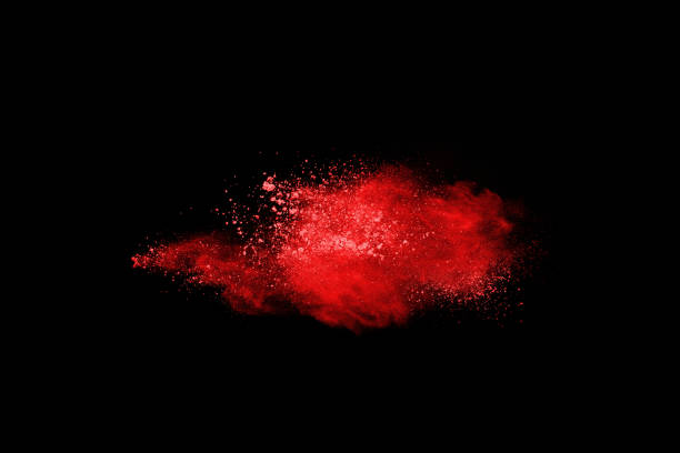 istock abstract red powder explosion on black background.abstract red powder splatted on black background. Freeze motion of red powder exploding. 1060557232