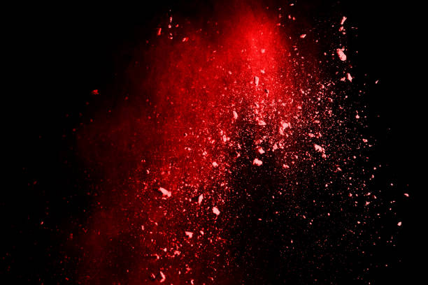 istock abstract red powder explosion on black background.abstract red powder splatted on black background. Freeze motion of red powder exploding. 1060557254