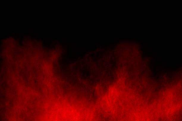 istock abstract red powder explosion on black background.abstract red powder splatted on black background. Freeze motion of red powder exploding. 1060557258