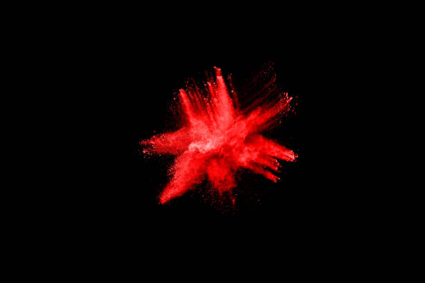 istock abstract red powder explosion on black background.abstract red powder splatted on black background. Freeze motion of red powder exploding. 1060557276