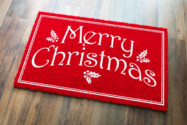 istock Merry Christmas Red Welcome Mat On Wood Floor Background 1060557370