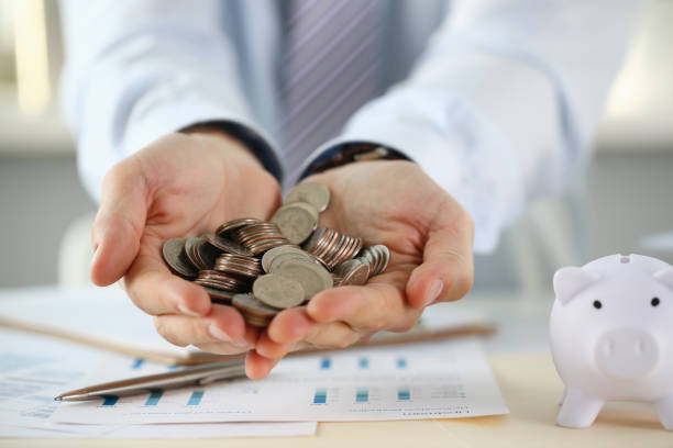 istock Hand businessman putting pin money 1060558510