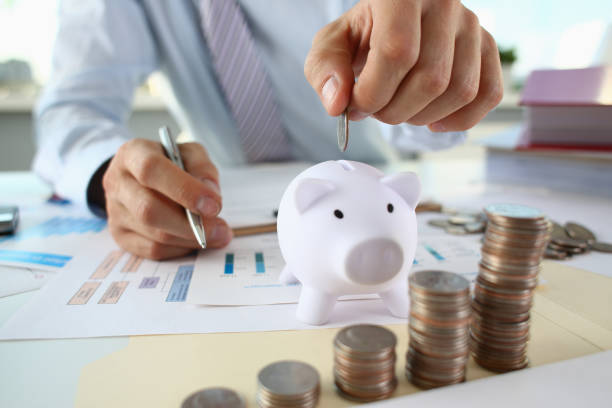 istock Hand businessman putting pin money 1060558548