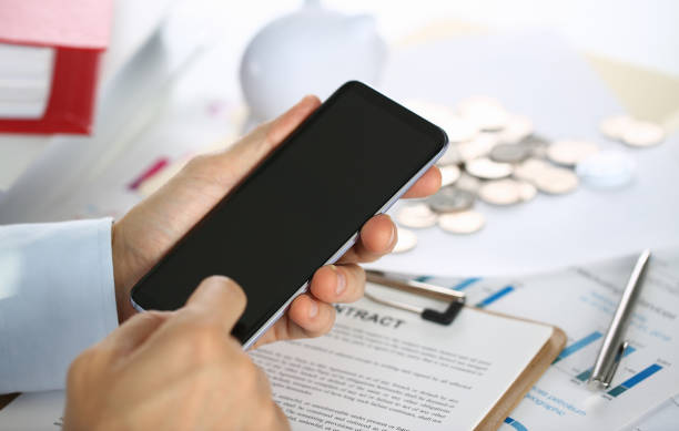 istock A businessman holds a new smartphone 1060558616