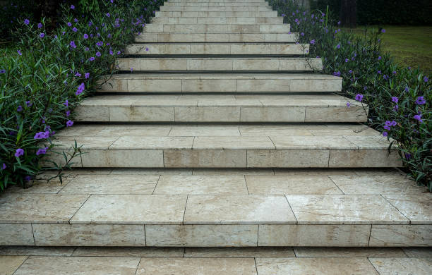 istock Marble tile stair way with purple flower in side 1060562248
