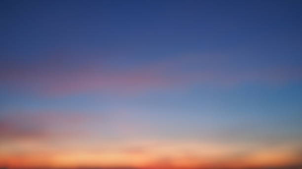 istock Blur background sky of atmosphere evening sunset. Dramatic skyline with dark blue sky and orange. 1060562450