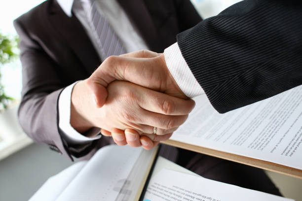 istock Man in suit shake hand as hello in office 1060563012
