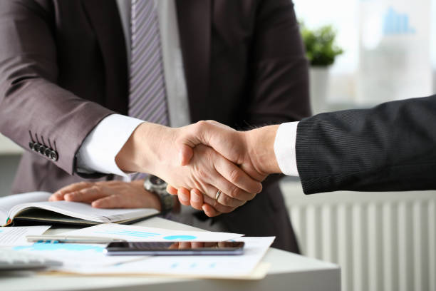 istock Man in suit shake hand as hello in office 1060563156