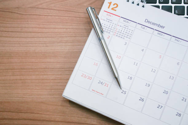 istock close up soft focus on silver pen over calendar 2018 at office desk with top view for make appointment or remember important event on date concept 1060565506
