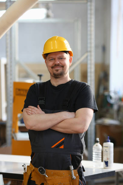 istock Portrait of young attractive man in work clothes 1060565922
