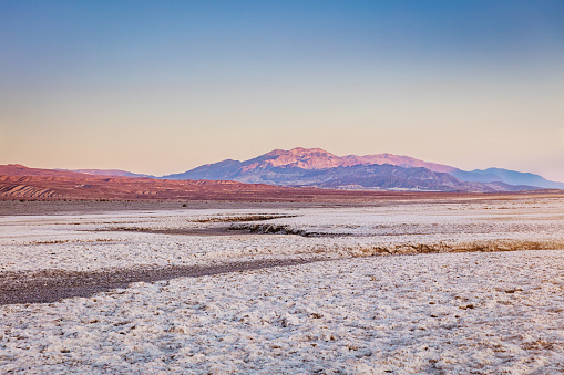 Sunset in the Salt Flat of Death Valley. Nevada, USA.