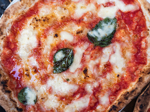istock Fresh, fragrant Neapolitan pizza with tomatoes and cheese 1060568022
