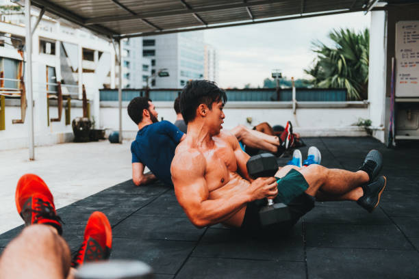 istock Muscular Asian guy on cross training 1060569102