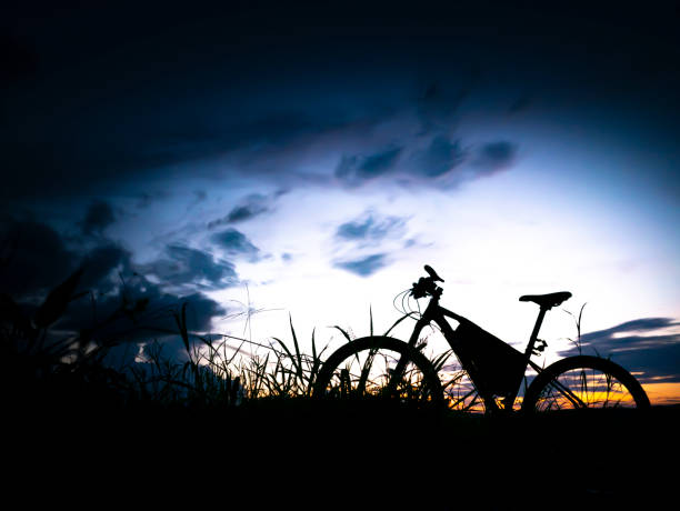 istock silhouette mountain bike in the dark light 1060569340
