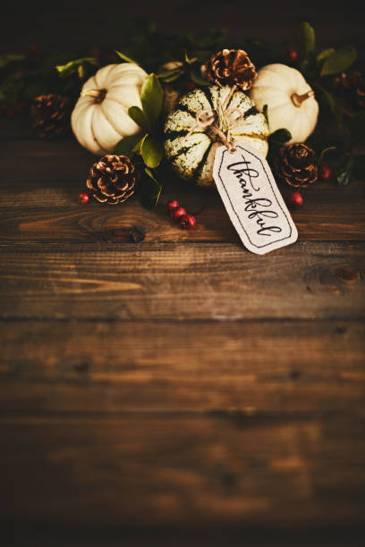istock Pumpkin assortment still life and thankful message 1060580832