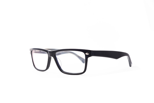 Rectangular black-rimmed glasses are located frontally on a white background. Isolated. side view