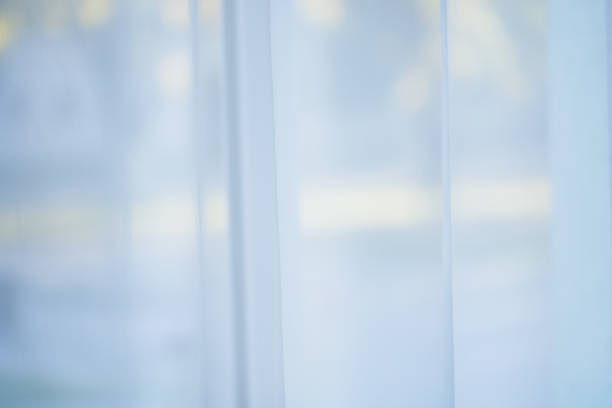 istock White tulle on window in building 1060586048
