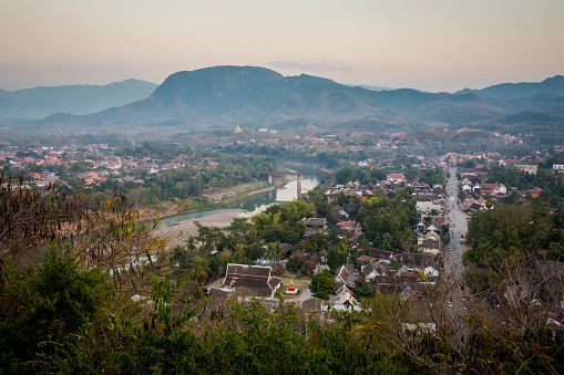 Amazing Buddhist Mount Phou Si temple in touristic Luang Prabang in Laos. Panorama of city from the top of  hill.