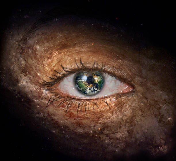 istock Eye in midst of Galaxy with Earth Reflection 1060592480