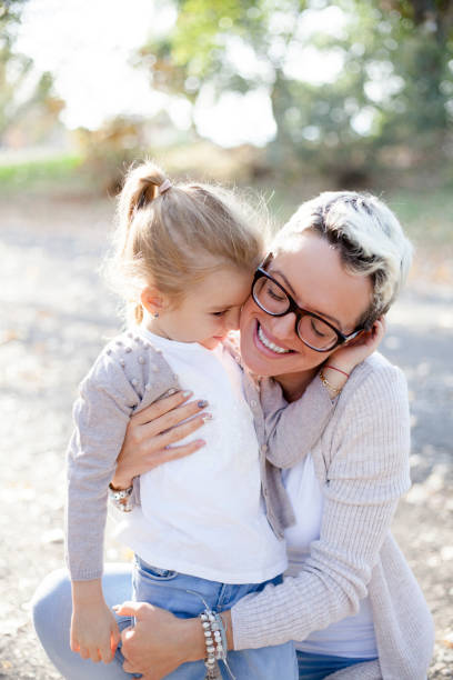 istock mother and daughter having fun outdoors 1060594580