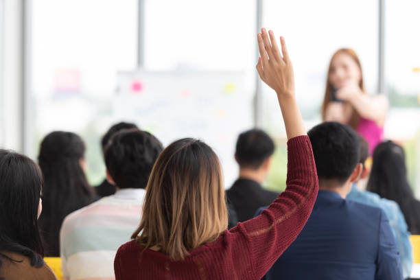 istock Student Raising Hand Up in a classroom. 1060599358