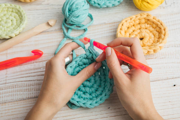 woman hands knitting crochet. hobby crafts things. top view. horizontal composition - textile sewing women part of imagens e fotografias de stock