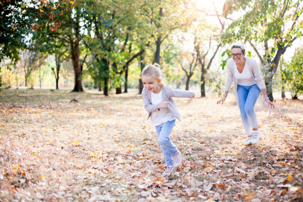 istock mother and daughter having fun outdoors 1060603884