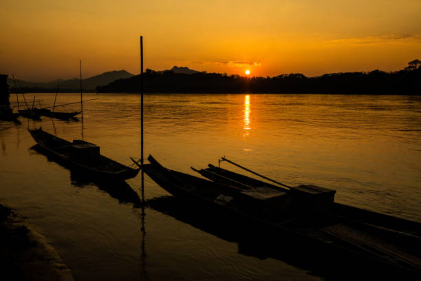 Summer sunset landscape above Mekong river taken in touristic Luang Prabang  in Laos. Colorful scenery in south east Asia.