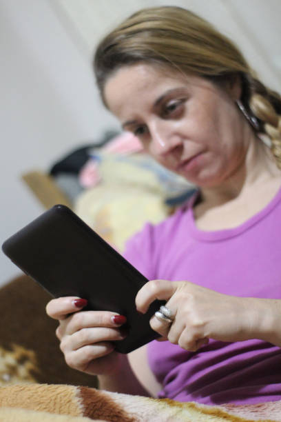 istock Woman in bed with tablet 1060605680