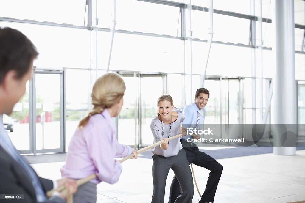 Business colleagues playing a game of tug of war  25-29 Years Stock Photo