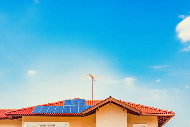 Photovoltaic power plant on the roof of a house on sunny day - Solar Energy concept of sustainable resources stock photo