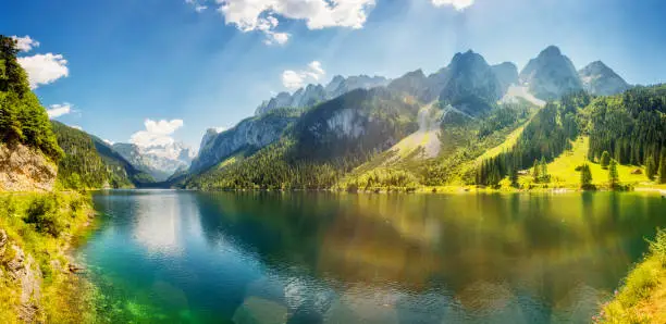Fantastic azure alpine lake Vorderer Gosausee. Unusual and picturesque scene. Salzkammergut is a famous resort area located in the Gosau Valley in Upper Austria. Dachstein glacier. Beauty world.
