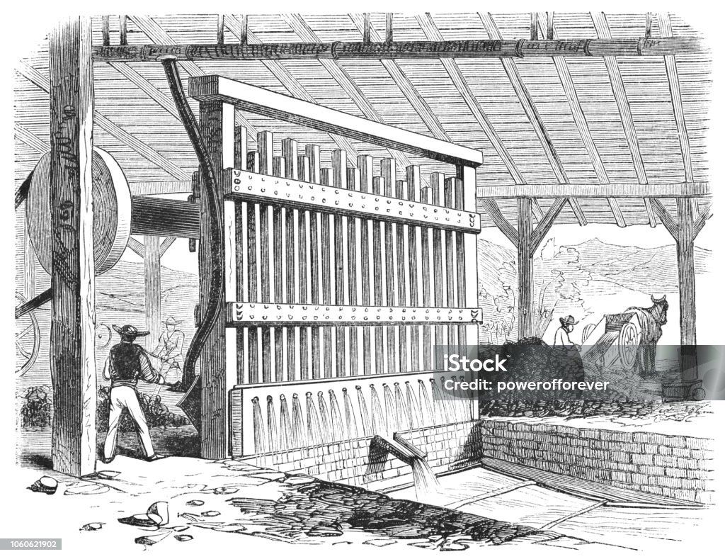 Stamping Batteries at a Stamp Mill in Grass Valley, California, USA (19th Century) Stamping batteries in a stamp mill used to crush quartz in mining gold at Grass Valley in California, United States of America (circa mid 19th century). Vintage etching circa mid 19th century. Gold Mine stock illustration