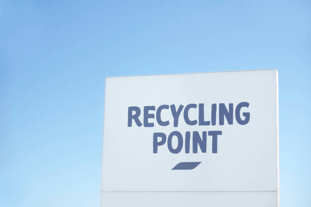 istock Recycling point direction sign against blue sky 1060623930