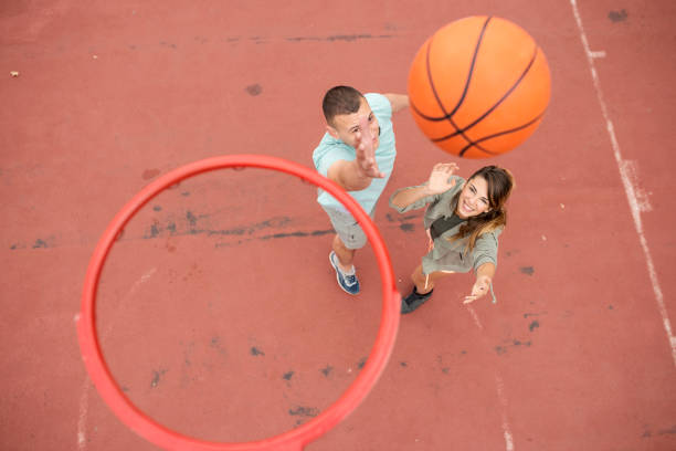 istock young man with a prosthetic leg playing basketball 1060628046