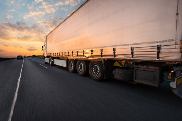 istock Truck with container on road, cargo transportation concept. 1060628086