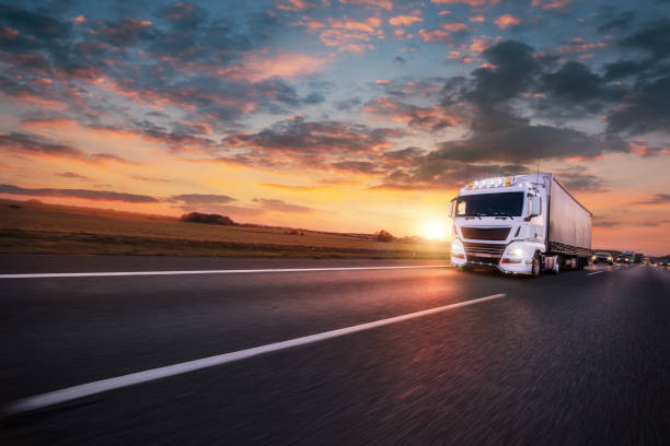istock Truck with container on road, cargo transportation concept. 1060628276