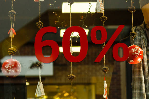 istock Shop-window information about sixty percent Christmas discounts 1060629058