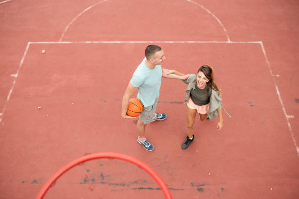 istock young man with a prosthetic leg playing basketball 1060630686