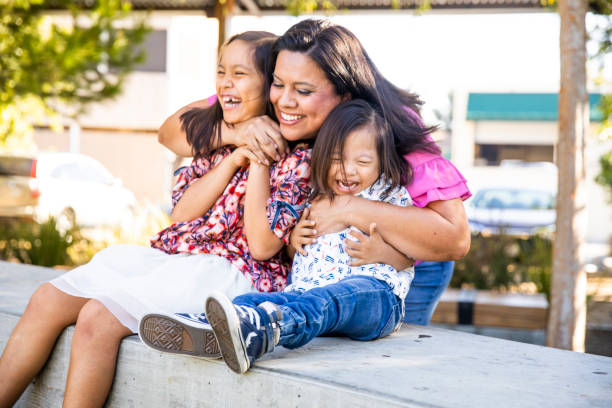 istock Hispanic Siblings Laughing in the Park 1060636928