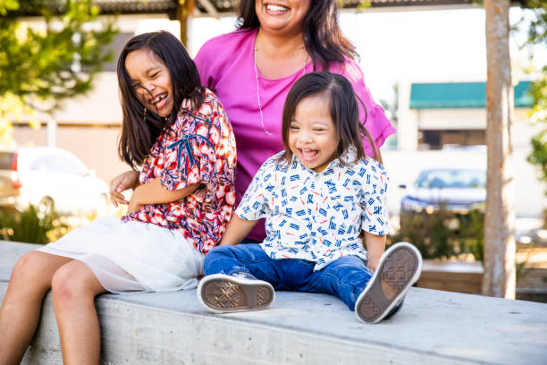 istock Hispanic Siblings Laughing in the Park 1060636930