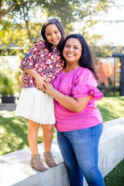 istock Hispanic Mother and Daughter Portrait 1060638154