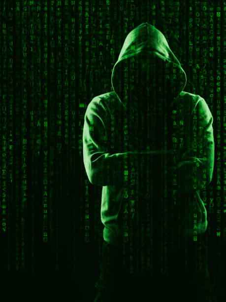 dark web hooded hacker stock photo
