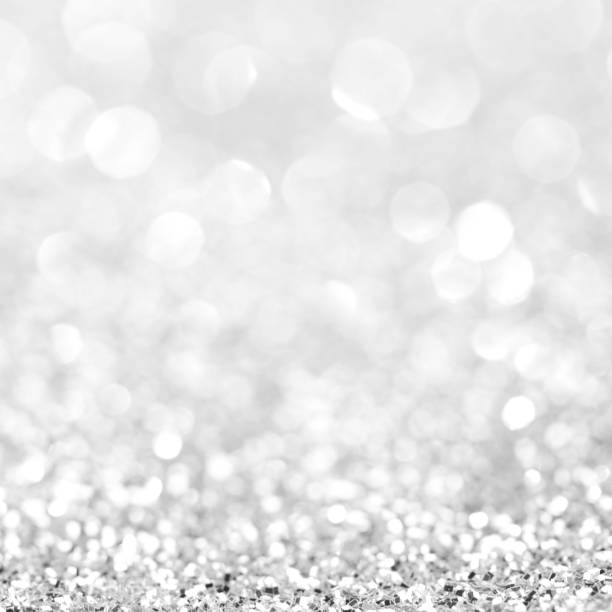 istock Silver festive glitter background with defocused lights 1060646506