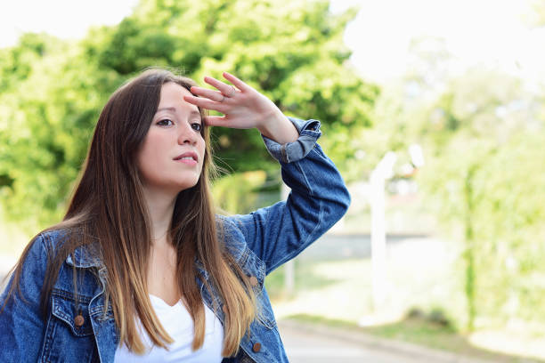 istock Young woman looking far with hand at her forehead. 1060648554