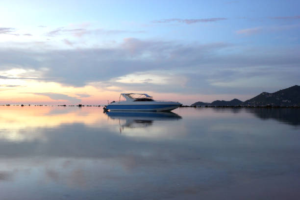 istock speed boat in the sea with beautiful sunrise 1060650556
