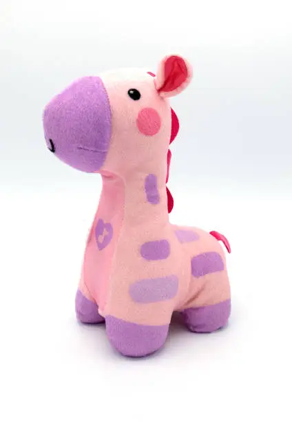 Giraffe plushie doll isolated on white background with shadow reflection.