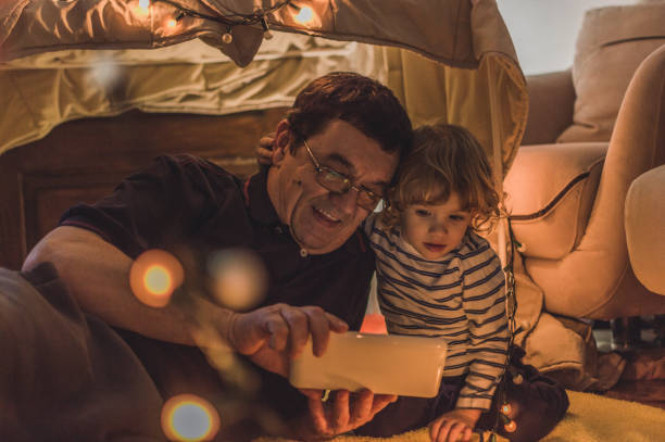istock Enjoying in a tent with my grandfather 1060651226