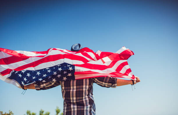istock Man holding USA flag 1060652480